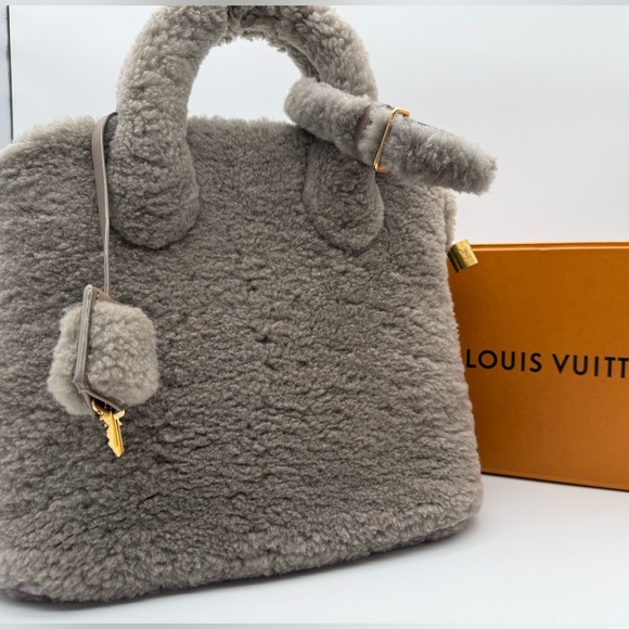 Louis Vuitton Handbags - Louis Vuitton Pulsion Lockit Gray Shearling Handbag (2011)